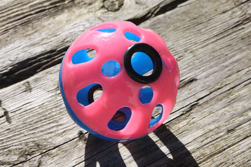 modified dog ball showing grommets for microphone